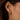 tapered gold huggie hoop earring worn on model