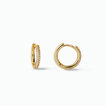Gold hoop earrings with embedded stones on a white background