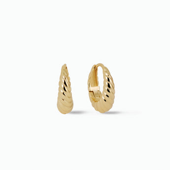 Gold hoop earrings on a white background
