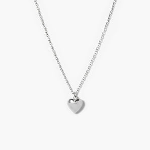Silver heart-shaped pendant necklace on a white background