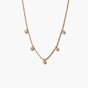 gold necklace with heart-shaped pendants on a white background